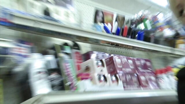 Blonde bombshell in sexy supermarket aisle shelves