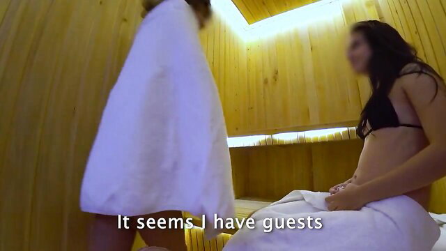 Two hot Asian MILFs in bikinis and towels in steamy sauna