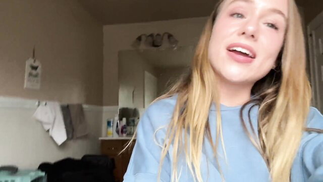 Briar Riley smiling selfie in blue hoodie, hot blonde amateur