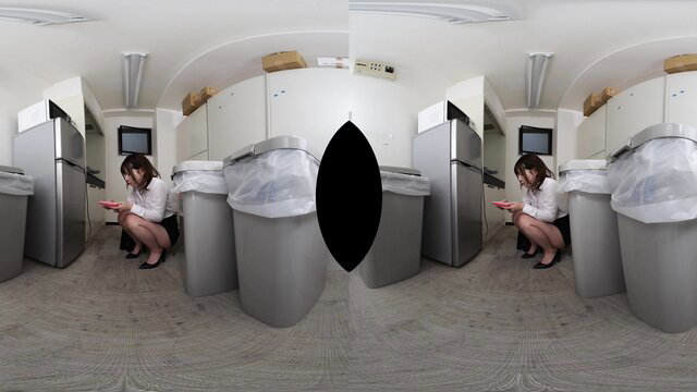 Asian office lady in skirt squats by trash bins in VR kitchen, phone in hand