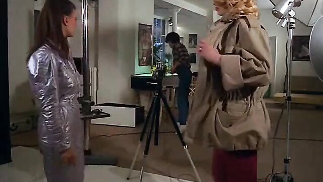 Vintage XXX thumbnail: brunette in silver dress seduces blonde in trenchcoat