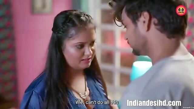 Indian couple in intimate moment, woman in blue dress says we can't do this