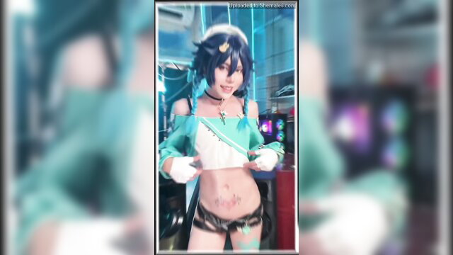 Velvet Chann sexy teal cosplay idol pose, abs tattoo, short blue hair
