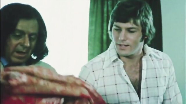 Vintage 1976 UK gay porn thumbnail two shaggy-haired men in shirts