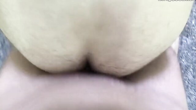 Closeup of woman's big pale hairy ass cheeks spread wide from behind