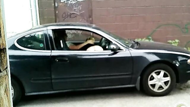 Naked hooker sucking cock in car, amateur blowjob caught on film