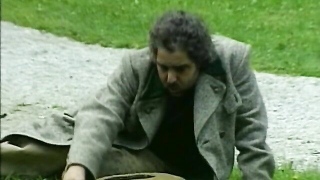 Man in trench coat kneeling on grass in classic 1995 Ejacula 2 film thumbnail