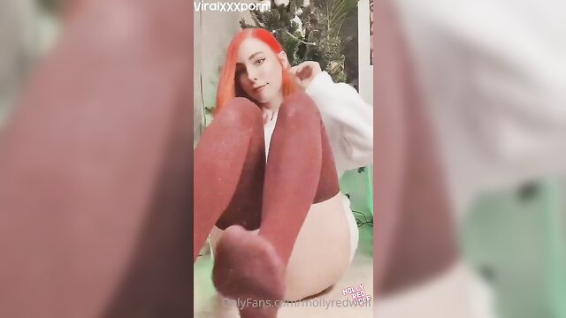MollyRedWolf teases soles in red stockings, perfect small tits