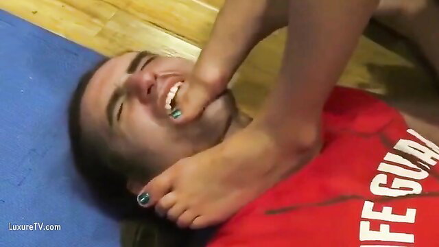 Femdom girl foot gagging smiling lifeguard guy on gym mat
