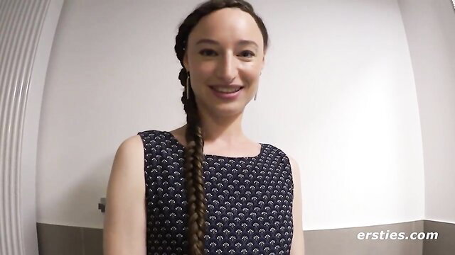 Smiling brunette with braid in tank top from Ersties lesbian sex machine video