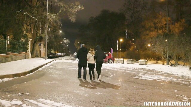 Alice Hatter walks snowy street with two men in hoodies, InterracialVision