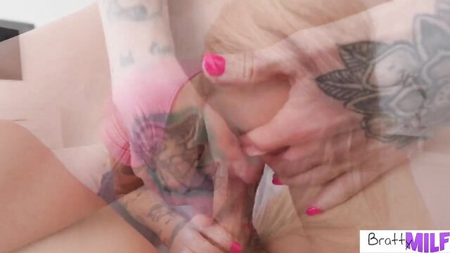 Tattooed blonde MILF Kaci Kennedy grips cock closeup
