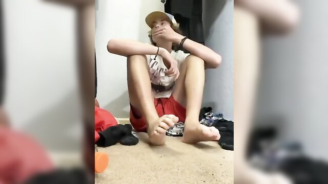 Skinny white dude in red shorts jerks off with foot fetish play