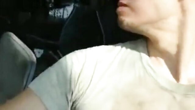 Hot guy masturbating in car at airport, white tee neckline tease