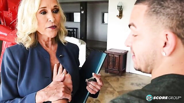 60Plus Realtor Katia in red blazer teases young client