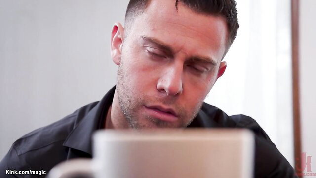 Seth Gamble sips coffee, intense gaze in threesome tease