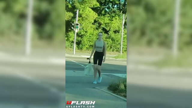 Fit brunette walks outdoors in tight shorts and sports bra, itchy pussy vibe