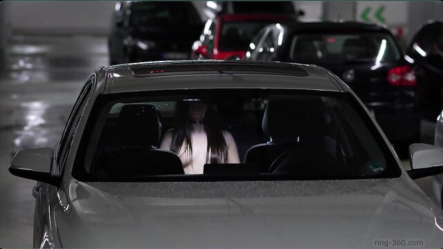 Pale girl with long dark hair forgetting pants nightmare in car parking garage