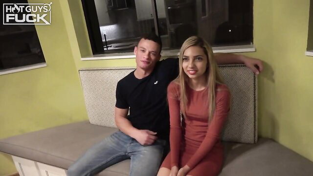 Rico Vega and Paris Niya couple on couch in tight dress