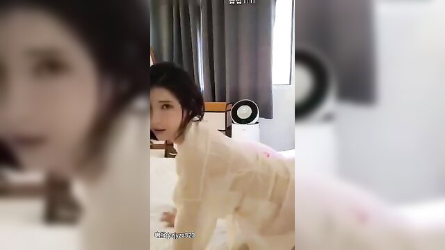 Korean car model in sheer lingerie on bed, seductive pose