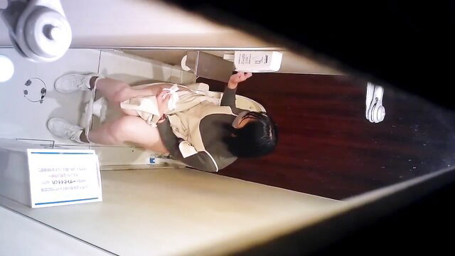 Asian woman spied on toilet peeing with legs spread in public bathroom