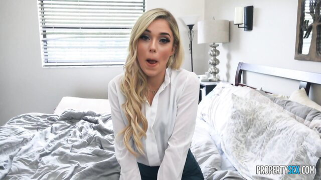 Blonde teen Kali Roses in white blouse on bed