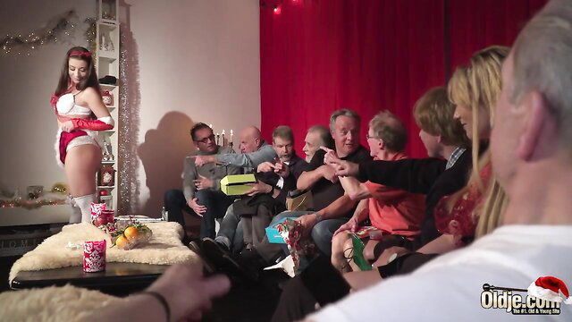 Redhead teen in sexy Santa lingerie teases 9 old men in Christmas orgy