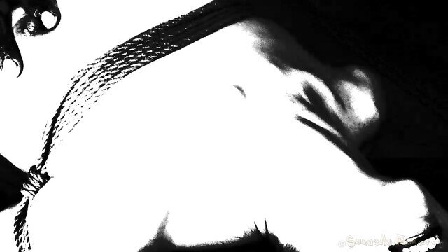 Closeup of submissive Japanese beauty's face in rough BDSM ecstasy