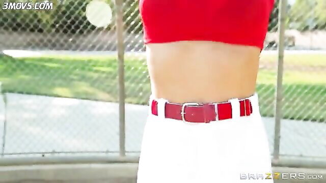 Audrey Bitoni in tight red crop top and white shorts at baseball field
