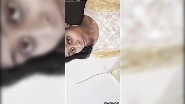 Upside-down view of cute Indian Tamil girl's face during sex