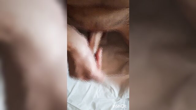 Blurry closeup of man stroking erect cock with lotion in solo masturbation