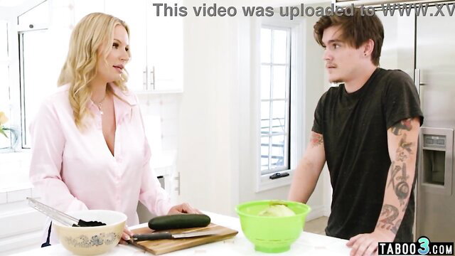 Curious blonde MILF stepmom in blouse with stepson in kitchen