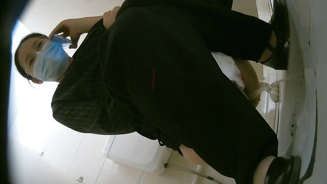 Asian woman in skirt on college toilet, masked POV spy cam closeup