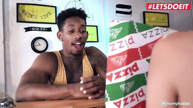 Pizza girl in sexy costume teases black guy in tank top