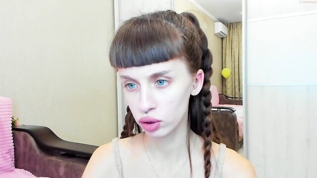 Flowerofsin2001 pouts with bangs and pigtails in sexy tank top