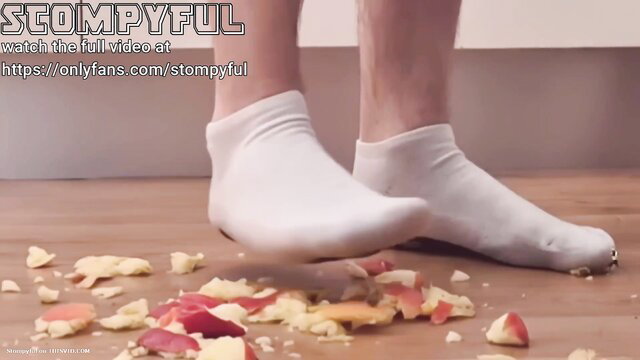 Man in white socks crushing apples on floor, full video on OnlyFans