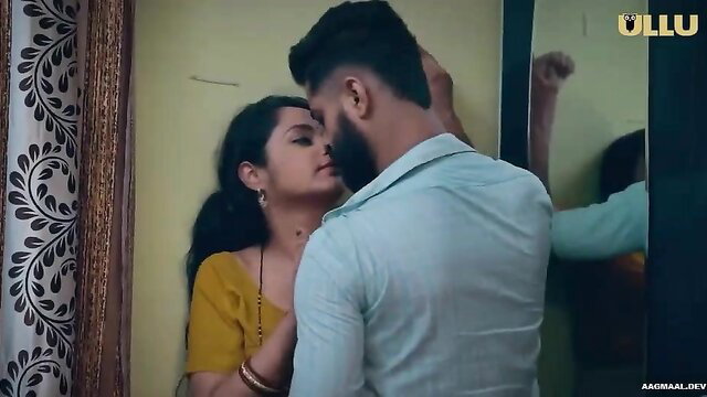 Indian MILF in yellow saree passionately kissed by man against wall