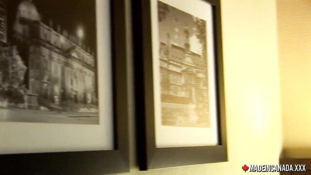 Vintage framed erotic photos on yellow wall in steamy adult scene