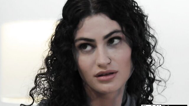 Lydia Black curly-haired beauty smirking seductively closeup