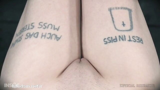 Bound submissive slave chick's thighs tattooed with pain pleasure text