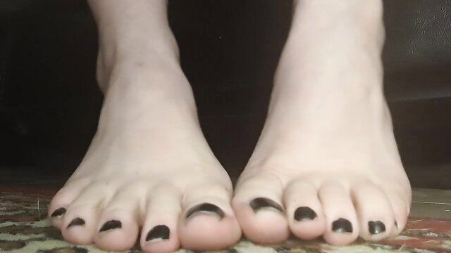 Pale soles and black toenails peeked under table in spy foot fetish vid