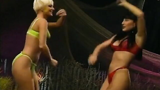 Two busty bikini babes dancing seductively in Party Doll A Go-Go #2