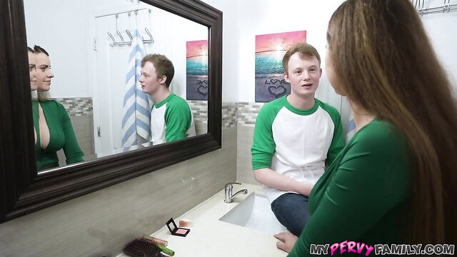 Busty brunette wife in green top teases handsome redhead hubby in bathroom