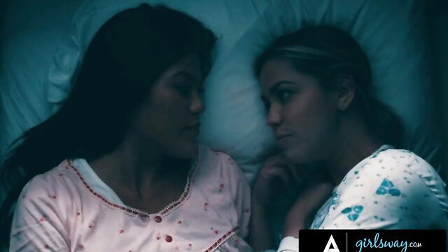 Alina Lopez and Kendra Spade as nuns in bed, intimate eye contact