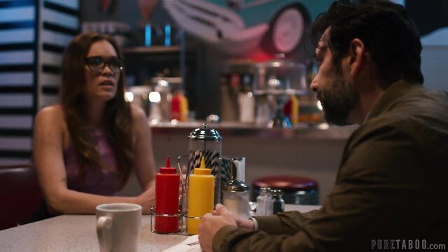 Katie Kush in purple top at diner table with handsome man