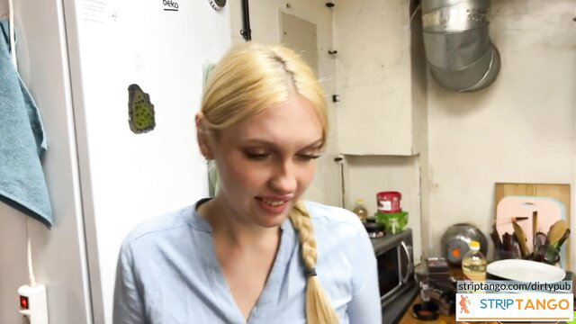 Blonde braid girl in light blue top sensual kitchen tease at stripTango