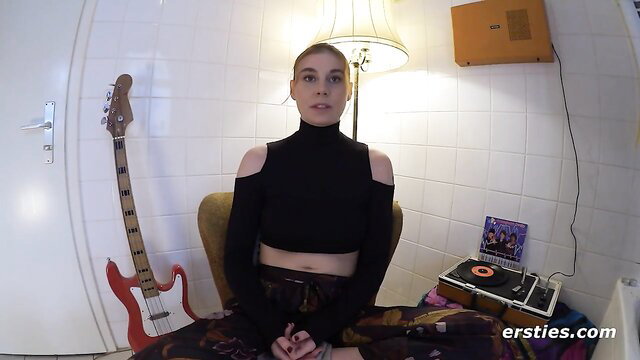 Hot German blonde in sexy off-shoulder top sits smiling in lesbian foursome preview