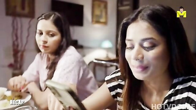 Two Indian women in hot striped top and pink blouse at table, Mastram web series