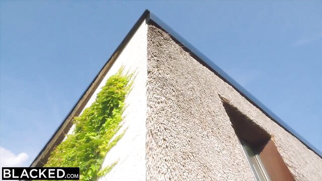 Stunning May outside thatched house with green ivy, EboBlack