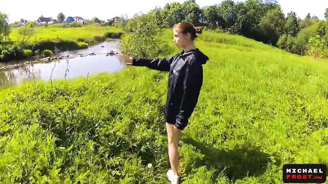 Country teen beauty in hoodie and shorts posing outdoors after school